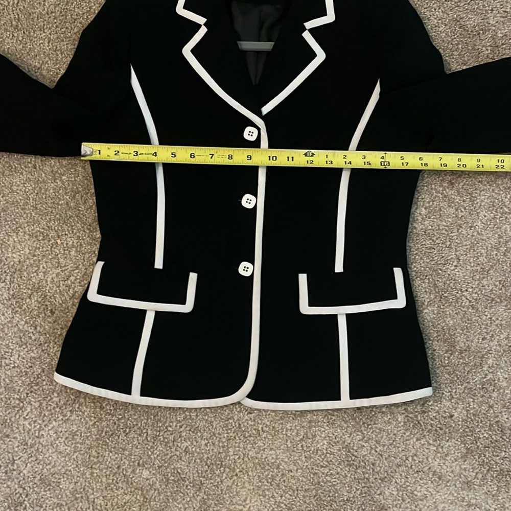 Le Suit Black and White Blazer with Contrast Trim and trousers.